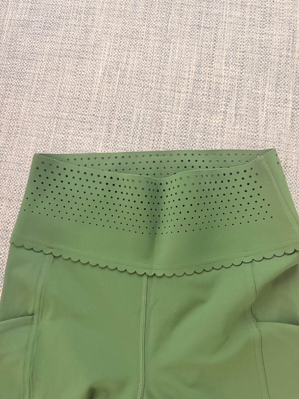 NWOT ululemon leggings with laser cut and scalloped waist detail. Never worn.
